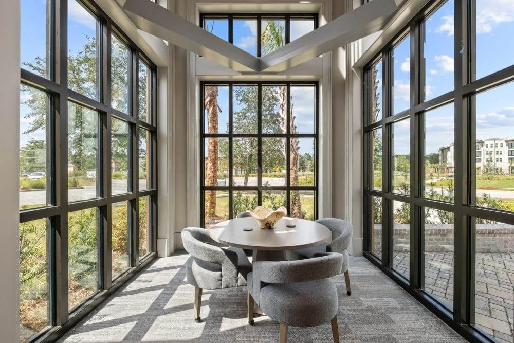 business center conference room at our apartments for rent in Charleston, SC,featuring carpeted floors and enclosed with windows.