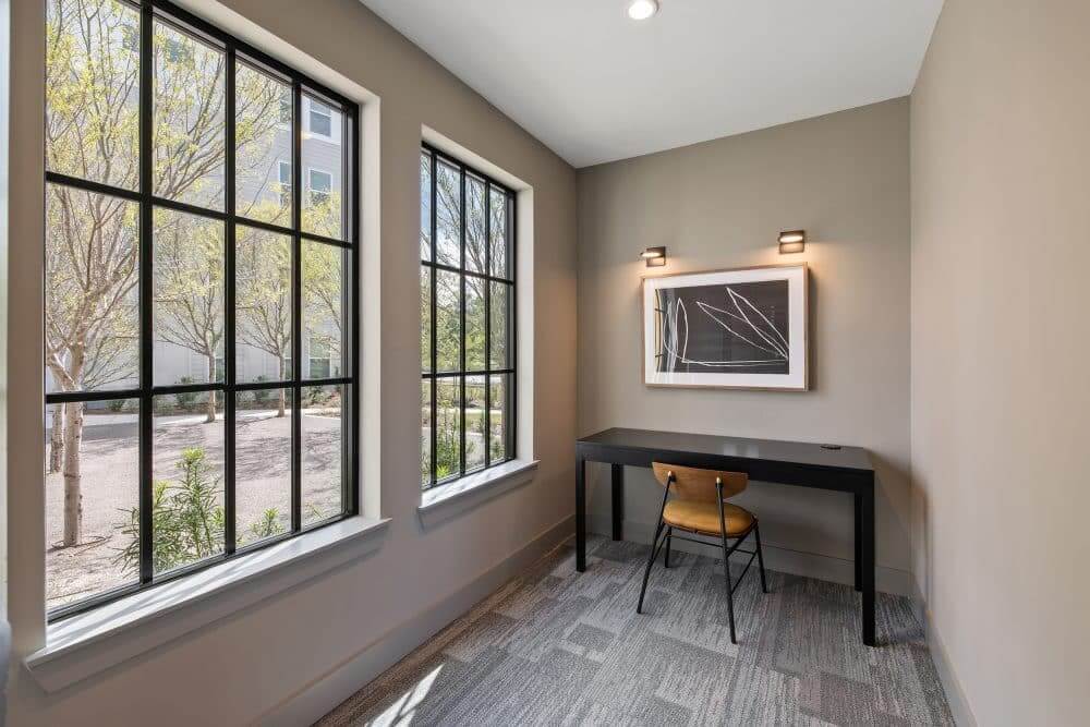 private cowroking desk in our business center featuring a desk and chair.